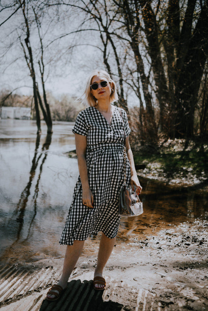 gingham wrap dress and a clear bag