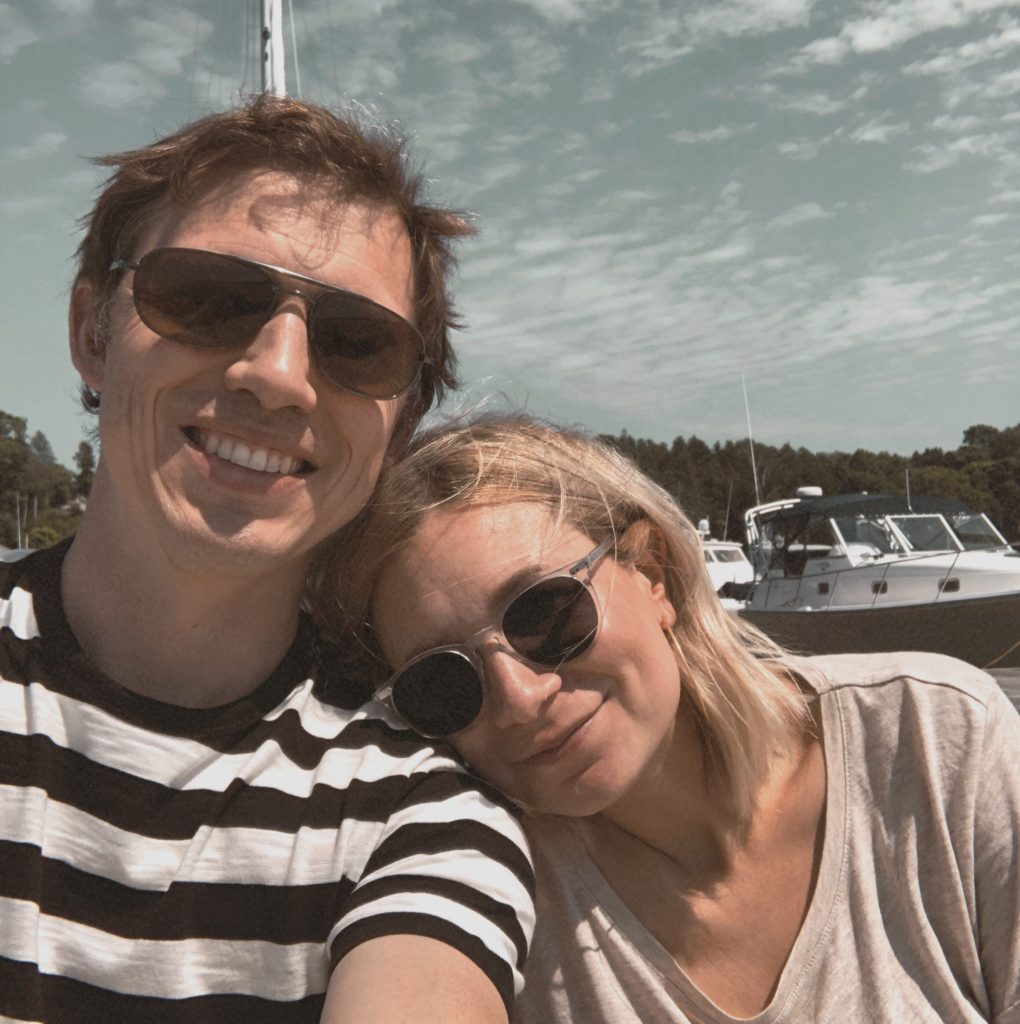 taking a selfie at the marina in egg harbor wisconsin, clear frame sunglasses, beige t-shirt, H&M t-shirt, everlane men's t-shirt, black and white striped tee