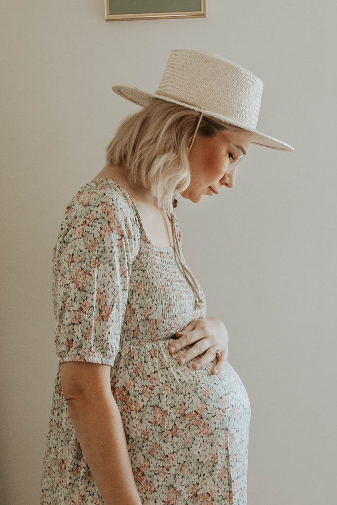 third trimester bump, floral maternity dress, straw hat