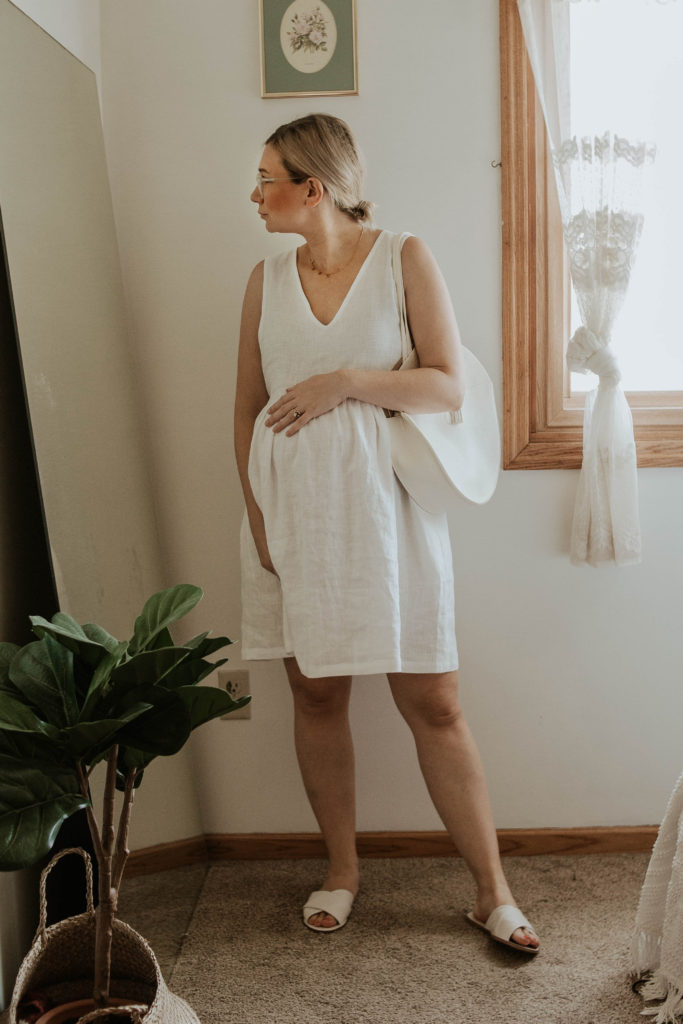 dressing for comfort, white linen dress, white sandals, white circle bag, linen maternity dress