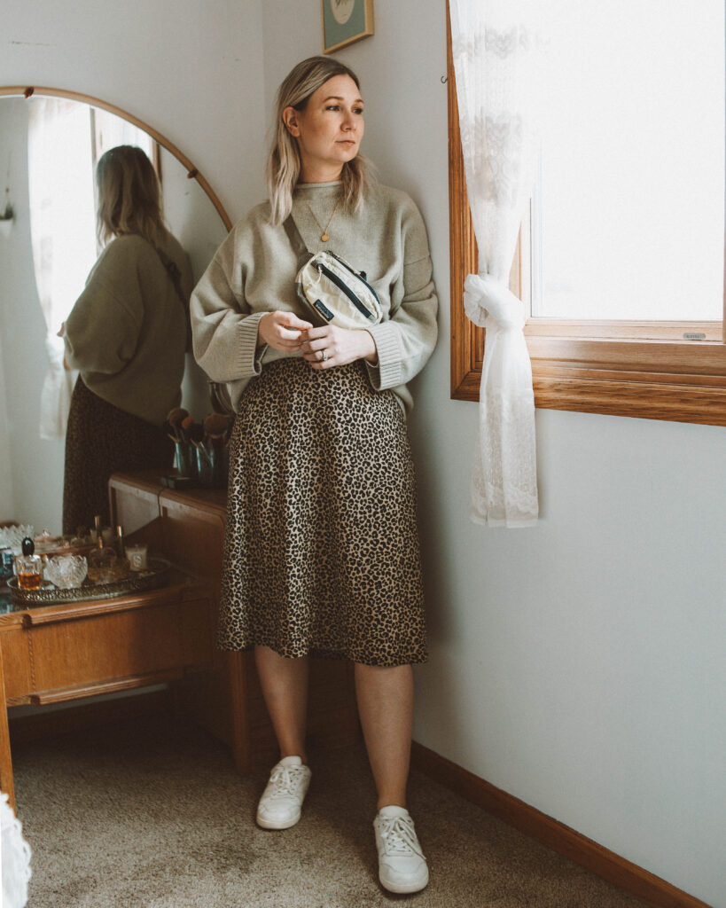 So here's what I actually wore this week, leopard print slip skirt, everlane tread court sneakers, james street co sweater review, patagonia hip pack